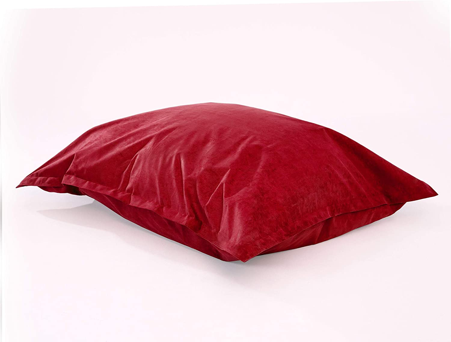 XXL Microvelours Sitzkissen in Rot liegt auf dem Boden vor weißem Hintergrund.