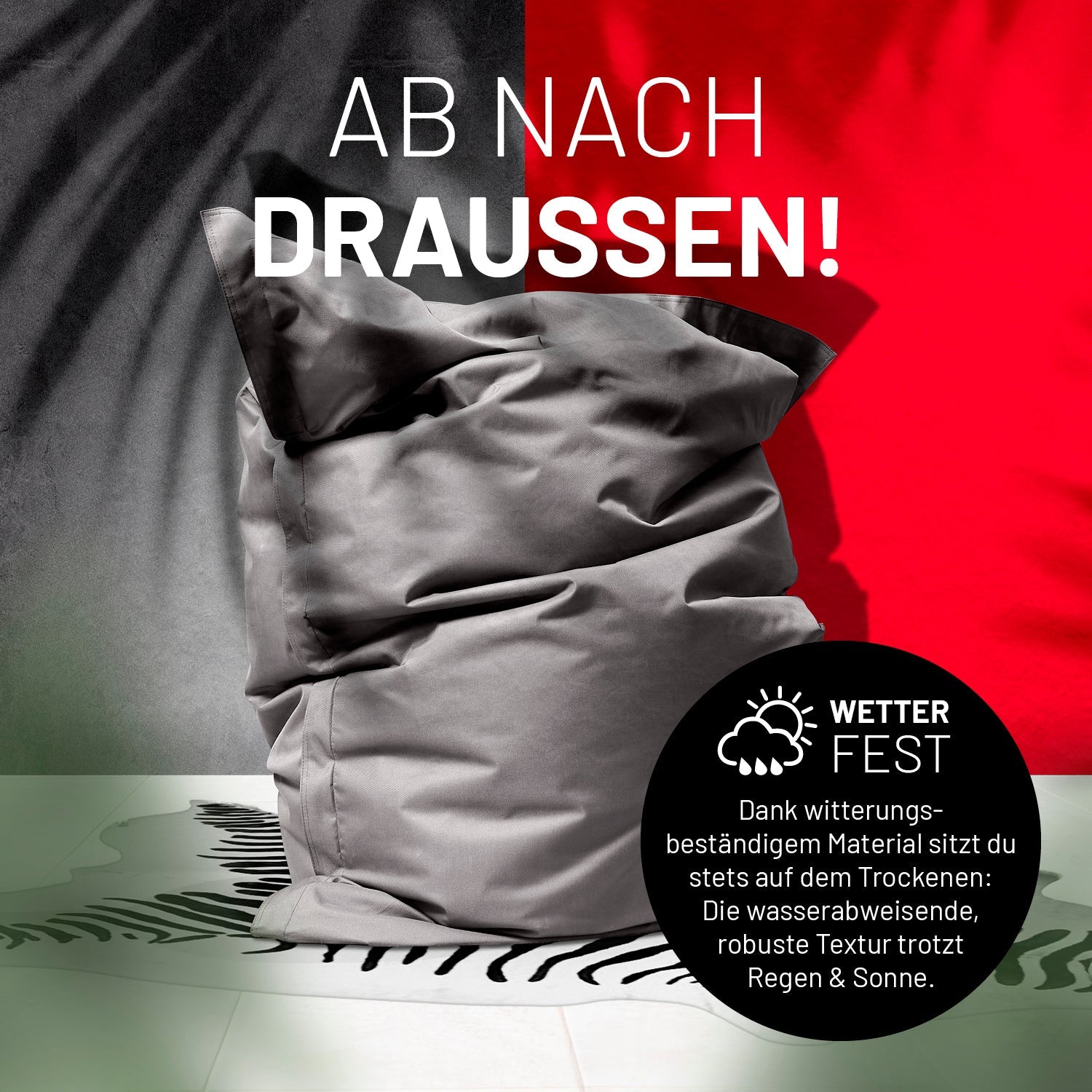 Sitzsack in Grau auf einer Terrasse mit dem Schatten von Palmen - "Wetterfest" und "Witterungsbeständiges Material."