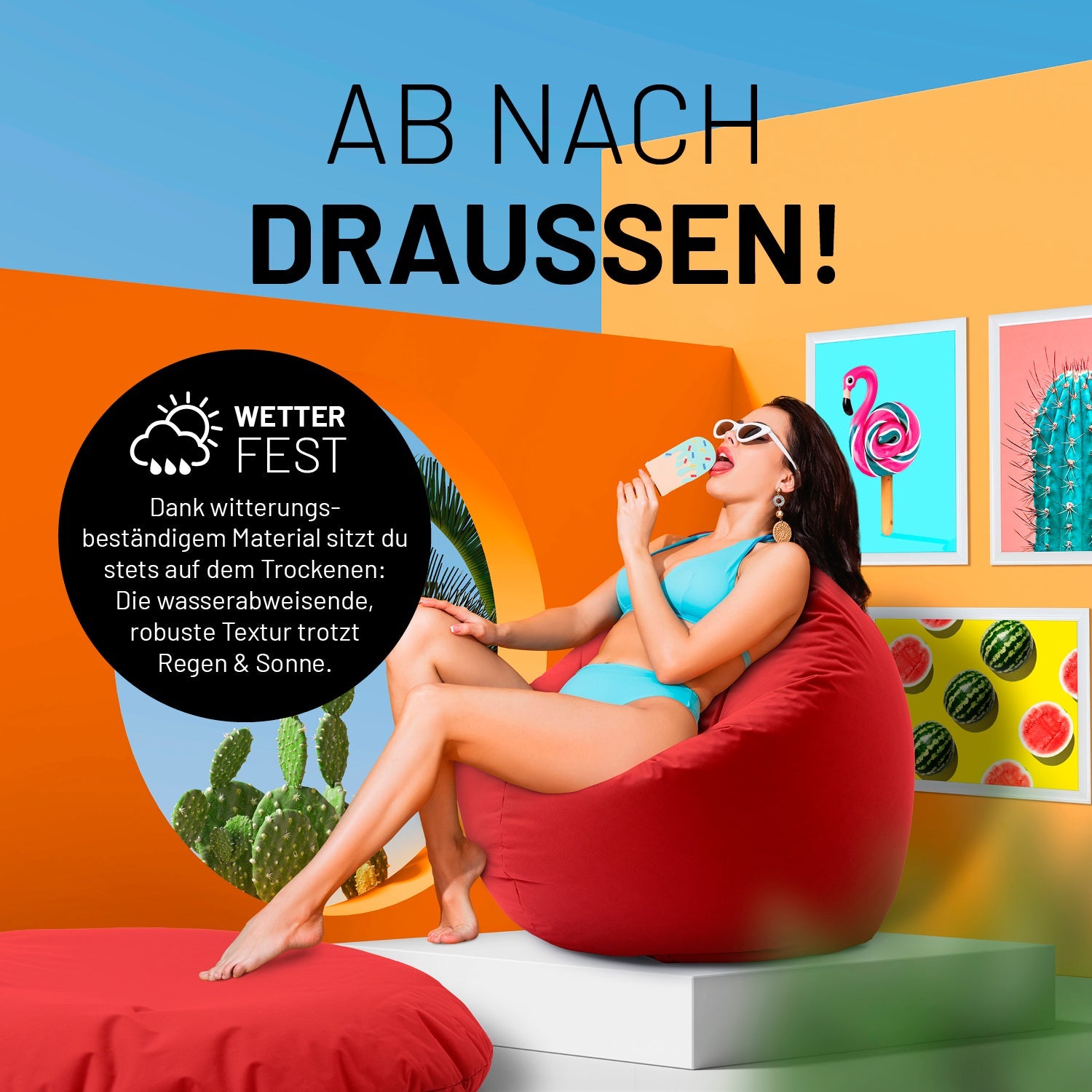Eine Frau sitzt auf dem roten Sitzsack und isst Eis in sehr bunten Szene - "Witterungsbeständiges Material."