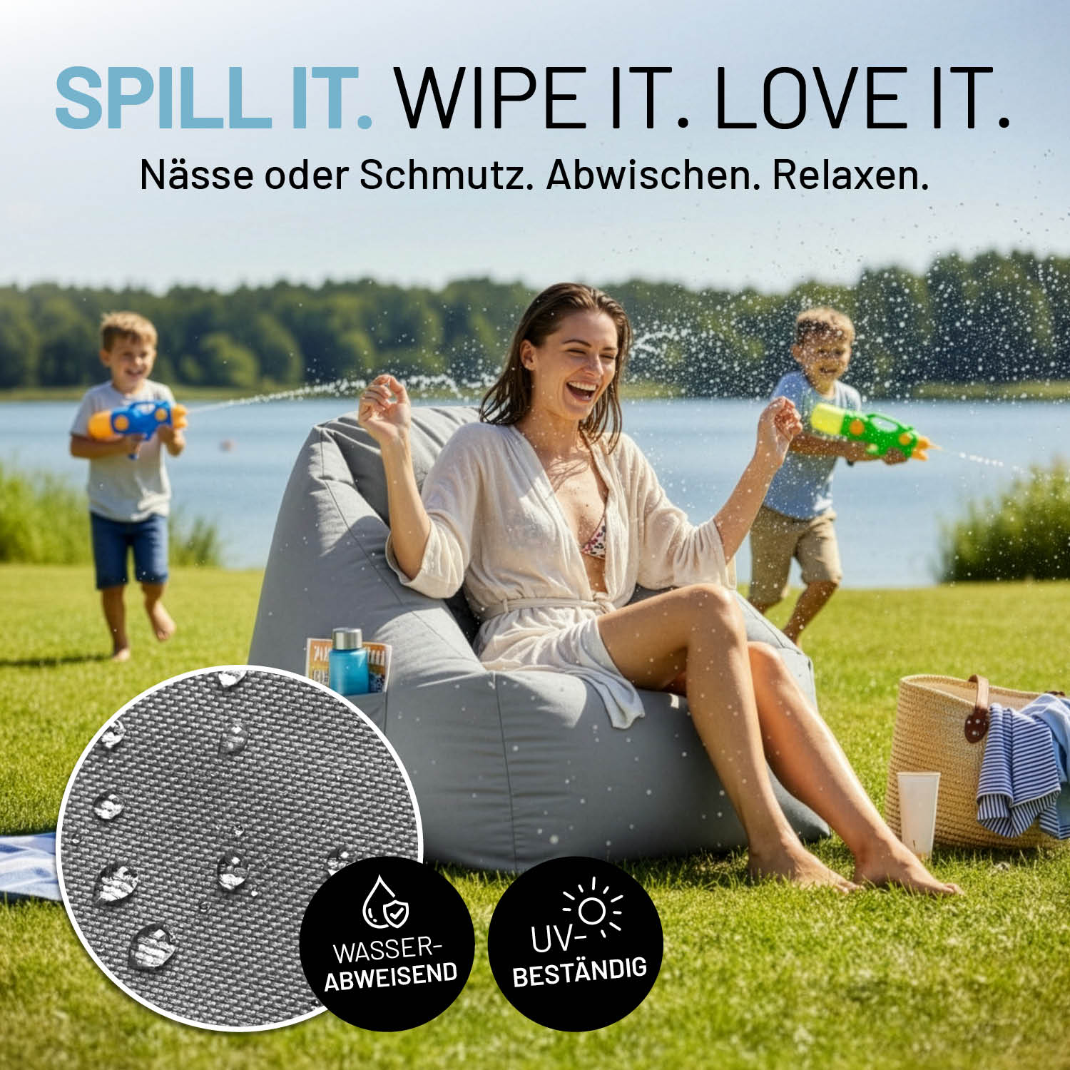 Frau sitzt lachend auf grauem CROZY AIR Sessel am See, Kinder spritzen Wasser. Infos zu "Bezug wasserabweisend", "UV-beständig" und "leicht abwischbar".