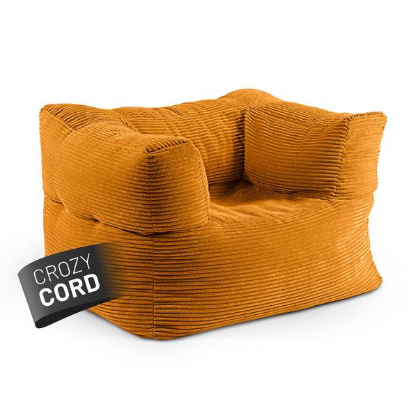 LUMALAND CORD-Sitzsack Sessel in Senfgelb aus der Reihe Modulares System vor weißem Hintergrund.
