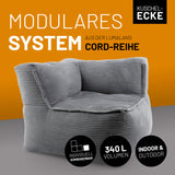 Graues Eckteil mit 340 L Volumen, individuell kombinierbar – ideal als modulares Sitzmöbel für den Indoor-Bereich.