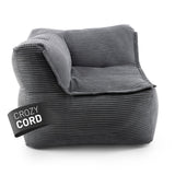 LUMALAND CORD-Sitzsack Eckteil links in Grau aus der Reihe Modulares System vor weißem Hintergrund.