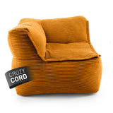 LUMALAND CORD-Sitzsack Eckteil links in Senfgelb aus der Reihe Modulares System vor weißem Hintergrund.