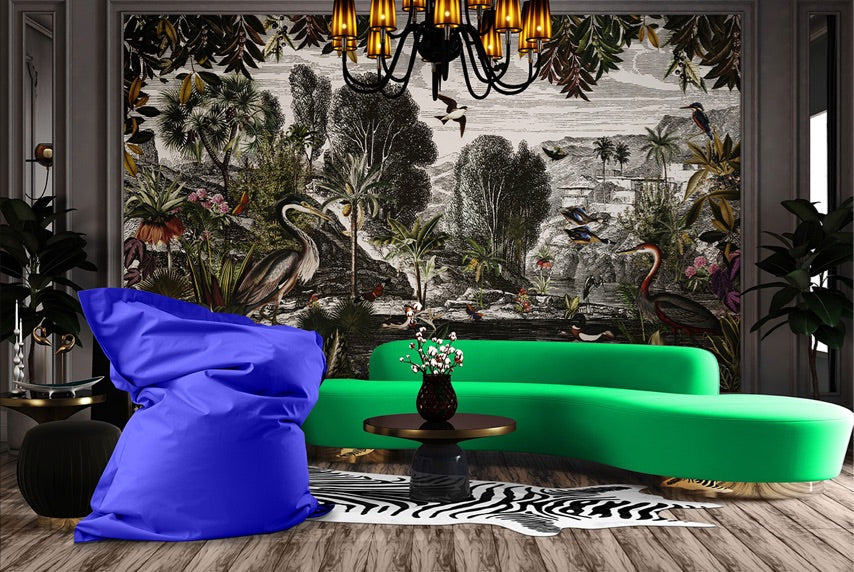 Ein Wohnzimmer mit Dschungel-Tapete, XXL Sitzsack in Royalblau, Zebra-Teppich und modernen Sofa für ein crozy Zuhause.